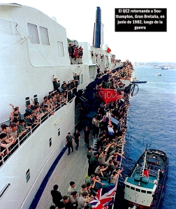 The QE2 returning to Southampton on June 11 1982, after its Falklands adventure. Troops wave to families on the quay while injured soldiers lie below deck